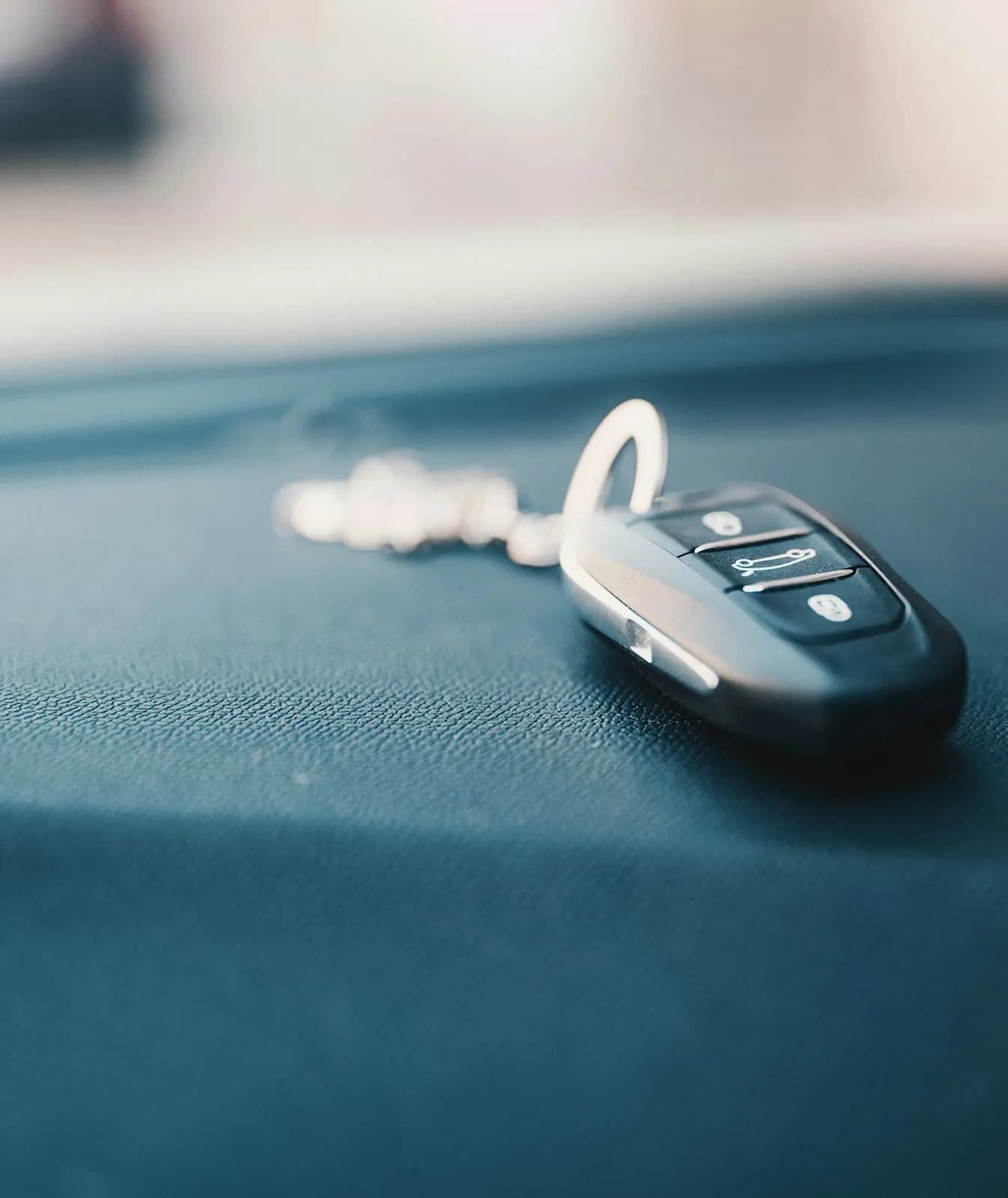 Car key fob resting on a dashboard