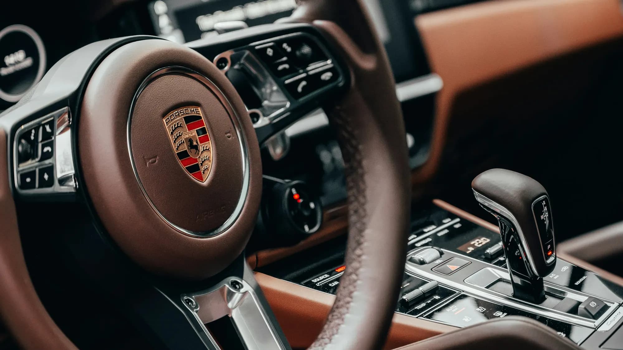 Porsche Cayenne steering wheel and brown leather interior